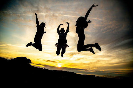 Silhouettes of Children Jumping In Air